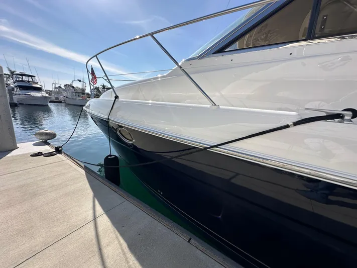 Phantom 42 Yacht Photos Pics 1998 Fairline Phantom 42 yacht docked at marina under clear blue sky.