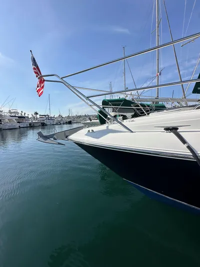 Phantom 42 Yacht Photos Pics 1998 Fairline Phantom 42 yacht docked in a marina, featuring sleek design and American flag.