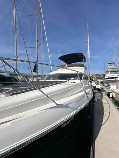 Phantom 42 Yacht Photos Pics 1998 Fairline Phantom 42 yacht docked at marina under clear blue sky.