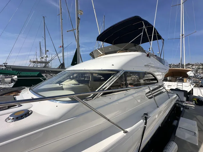 Phantom 42 Yacht Photos Pics 1998 Fairline Phantom 42 yacht docked at marina under clear blue sky.