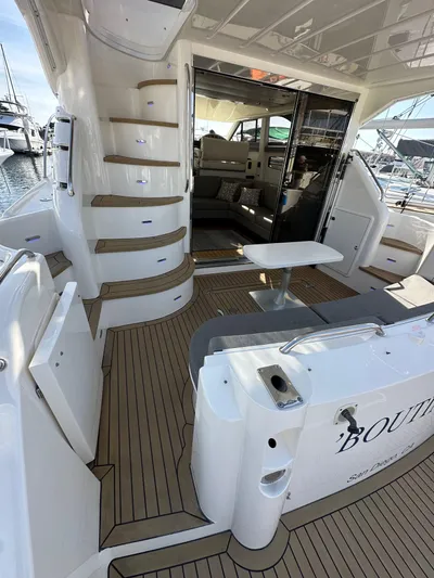 Phantom 42 Yacht Photos Pics 1998 Fairline Phantom 42 yacht interior with teak flooring and modern seating area.