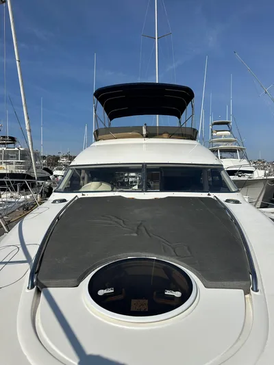 Phantom 42 Yacht Photos Pics 1998 Fairline Phantom 42 yacht docked in marina, front view with sunroof and canopy.