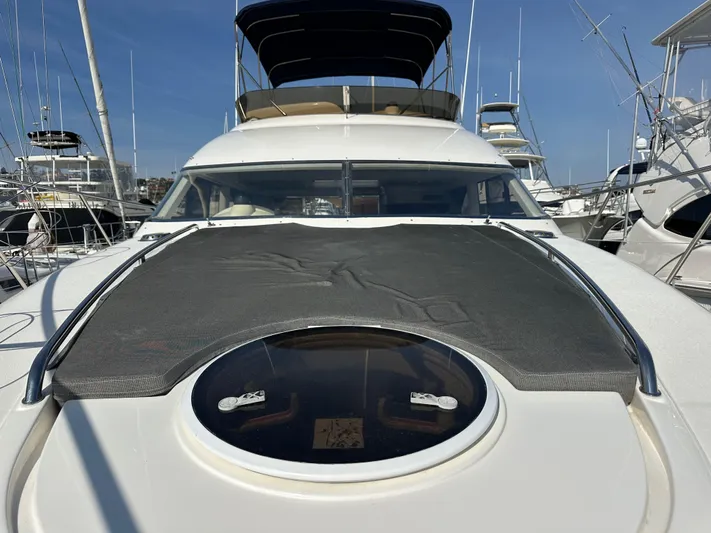 Phantom 42 Yacht Photos Pics 1998 Fairline Phantom 42 yacht with sunroof, docked at marina.