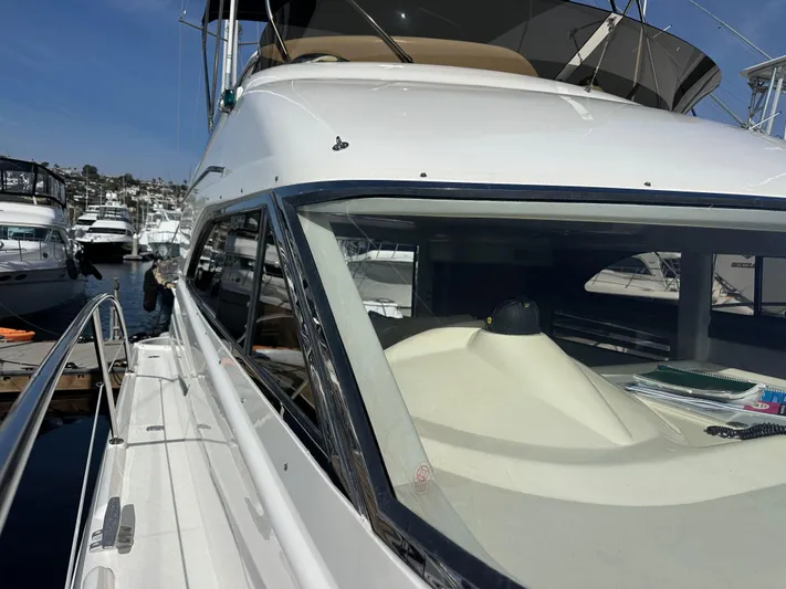 Phantom 42 Yacht Photos Pics 1998 Fairline Phantom 42 yacht docked, showcasing sleek design and spacious deck.