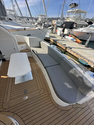 Phantom 42 Yacht Photos Pics 1998 Fairline Phantom 42 yacht with spacious deck seating at a marina.