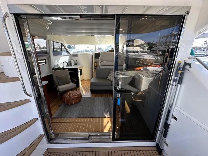 Phantom 42 Yacht Photos Pics 1998 Fairline Phantom 42 yacht interior with modern seating and wooden flooring.