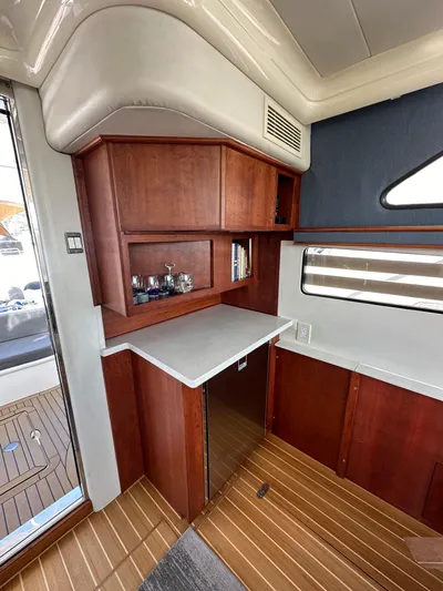 Phantom 42 Yacht Photos Pics Interior of 1998 Fairline Phantom 42 yacht with wooden cabinetry and modern design.