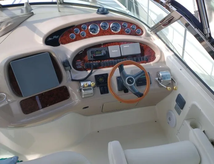 Cdog Yacht Photos Pics 2001 Sea Ray 380 Sundancer helm with wood accents and modern controls.