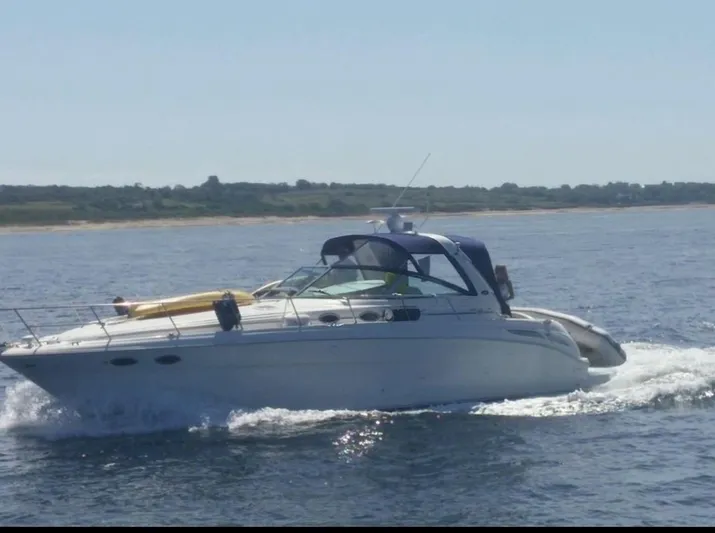 Cdog Yacht Photos Pics 2001 Sea Ray 380 Sundancer cruising on open water under clear skies.