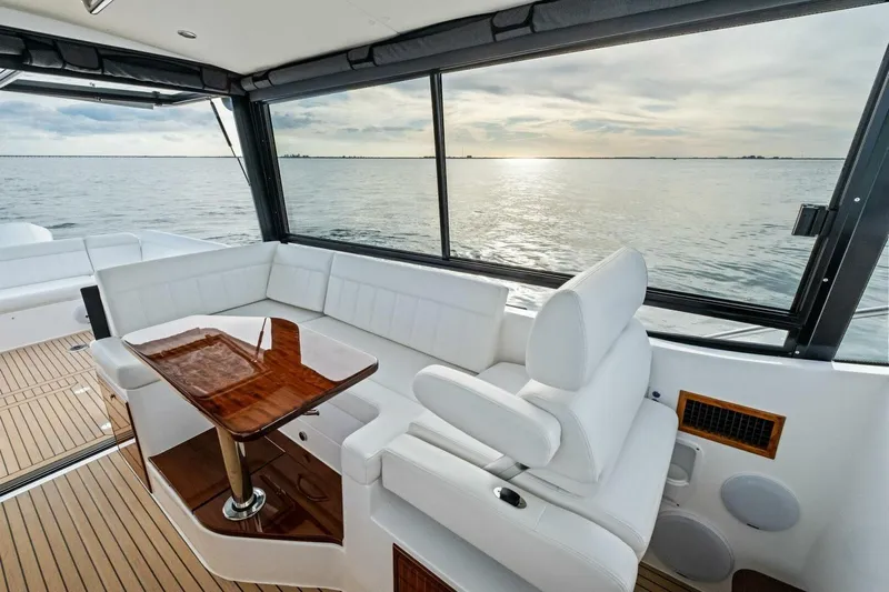  Yacht Photos Pics Luxurious interior of 2025 MJM 42 yacht with ocean view and elegant seating.