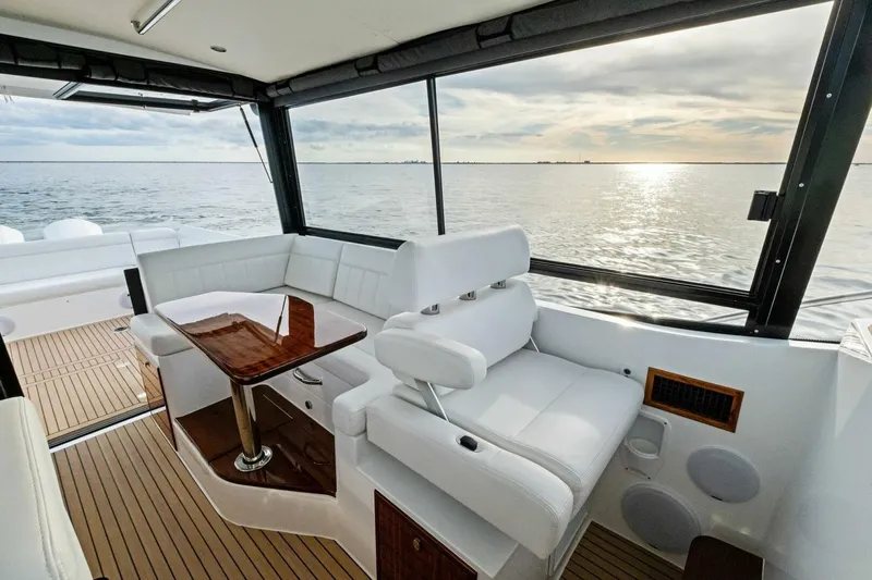  Yacht Photos Pics Luxurious interior of 2025 MJM 42 yacht with ocean view and elegant seating.