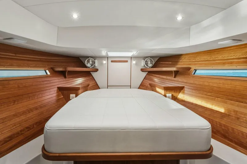  Yacht Photos Pics Luxurious interior of 2025 MJM 42 yacht with wooden accents and modern lighting.
