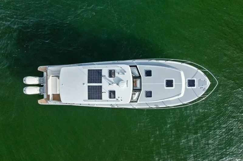  Yacht Photos Pics Aerial view of 2025 MJM 42 yacht on green water.