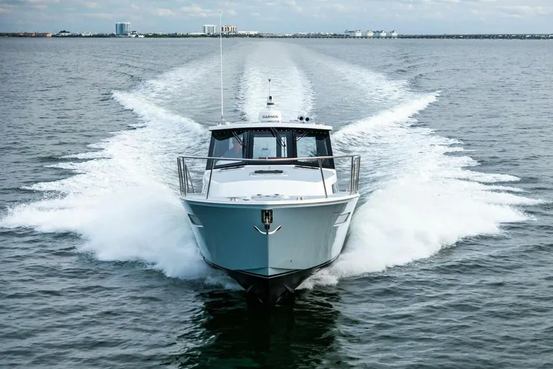  Yacht Photos Pics 2025 MJM 42 yacht cruising swiftly on open water.