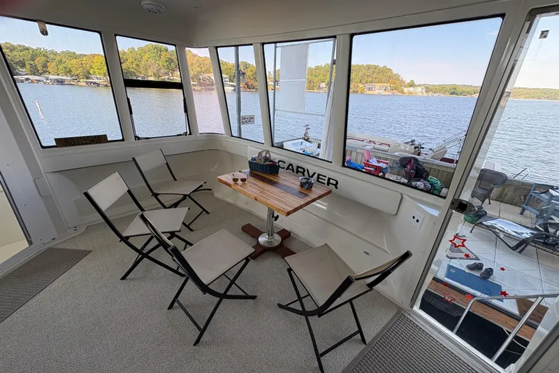  Yacht Photos Pics Interior of 2002 Carver 506 Motor Yacht with lake view and seating area.