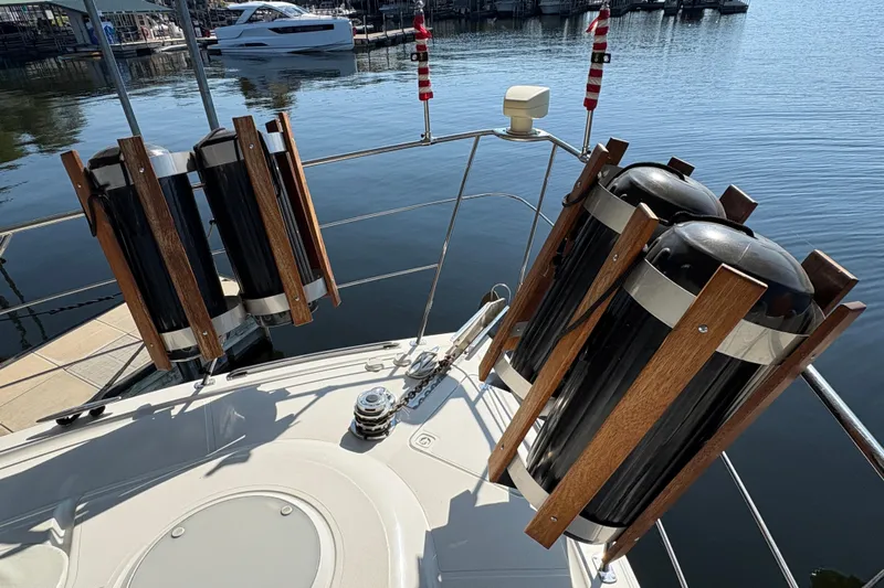  Yacht Photos Pics 2002 Carver 506 Motor Yacht deck with fender holders, docked at marina.