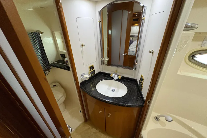  Yacht Photos Pics Luxurious bathroom in 2002 Carver 506 Motor Yacht with elegant fixtures and modern design.
