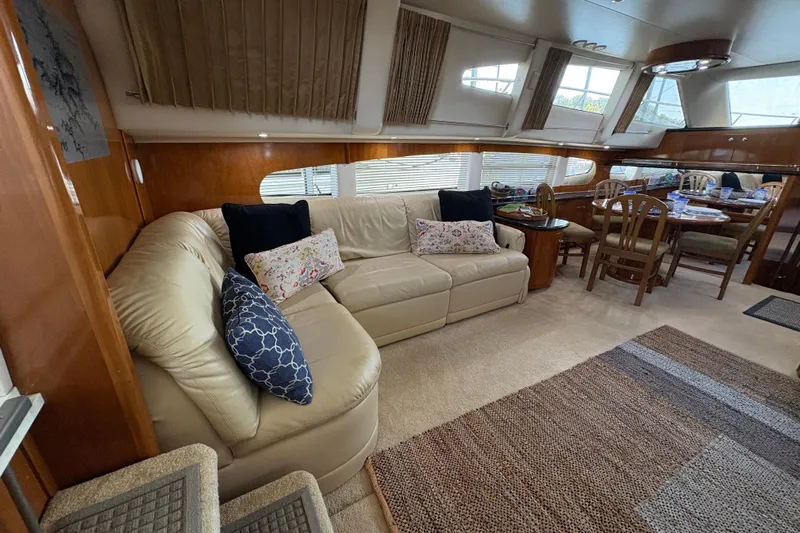  Yacht Photos Pics Luxurious interior of 2002 Carver 506 Motor Yacht with plush seating and dining area.