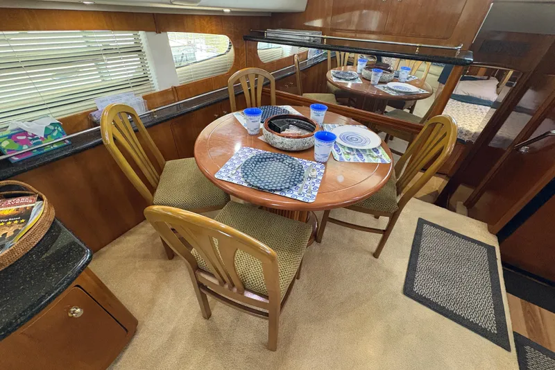  Yacht Photos Pics Interior of 2002 Carver 506 Motor Yacht with dining table and chairs.