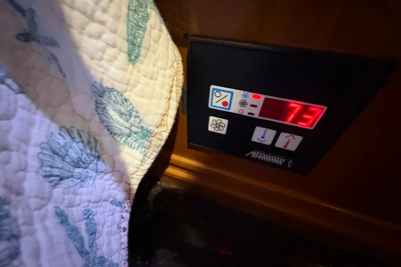  Yacht Photos Pics Control panel on 2002 Carver 506 Motor Yacht displaying temperature at 73 degrees.