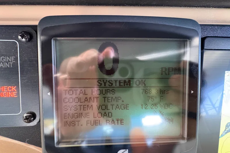  Yacht Photos Pics Display screen of a 2002 Carver 506 Motor Yacht showing engine metrics.