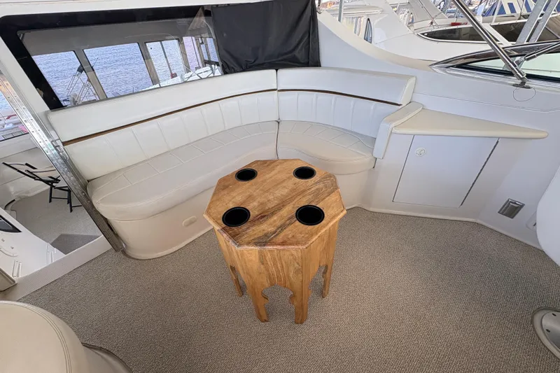  Yacht Photos Pics Luxurious interior of 2002 Carver 506 Motor Yacht with elegant seating and wooden table.