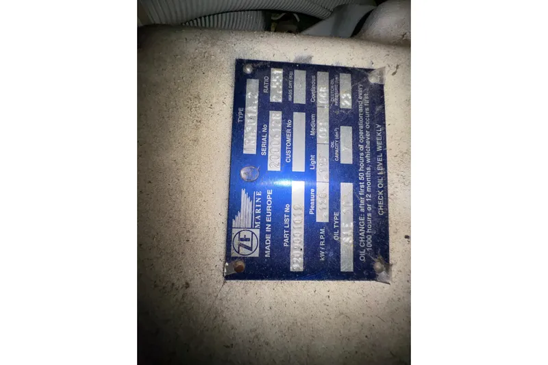  Yacht Photos Pics 2002 Carver 506 Motor Yacht engine plate with specifications and maintenance instructions.