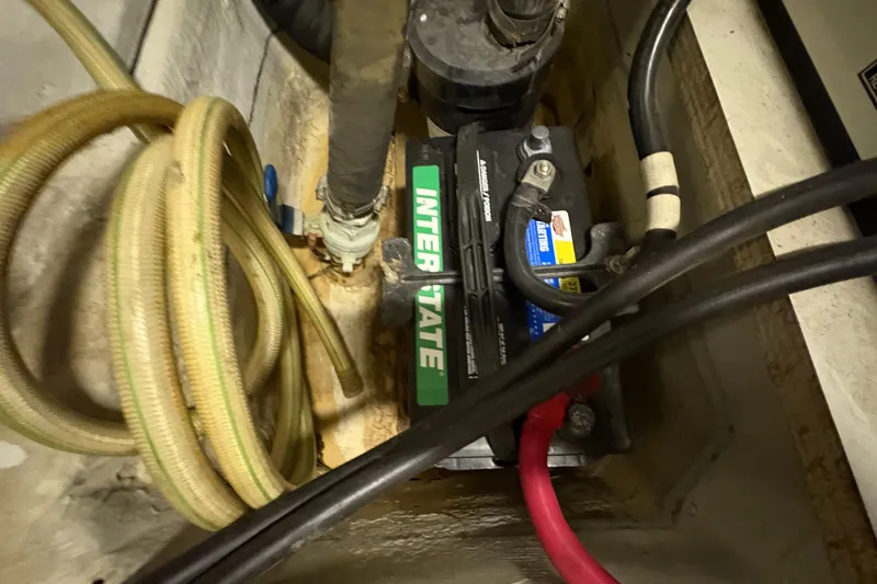  Yacht Photos Pics Battery compartment of a 2002 Carver 506 Motor Yacht with cables and hoses.
