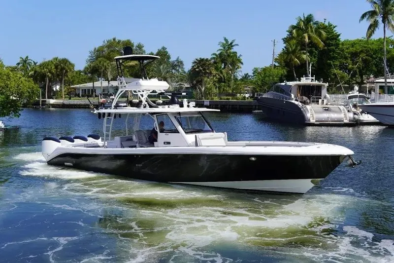 Yacht Photos Pics 2016 Everglades 435 Center Console boat cruising on a scenic waterway.