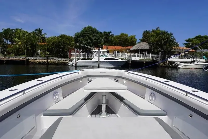  Yacht Photos Pics 2016 Everglades 435 Center Console boat docked, featuring spacious seating and sleek design.