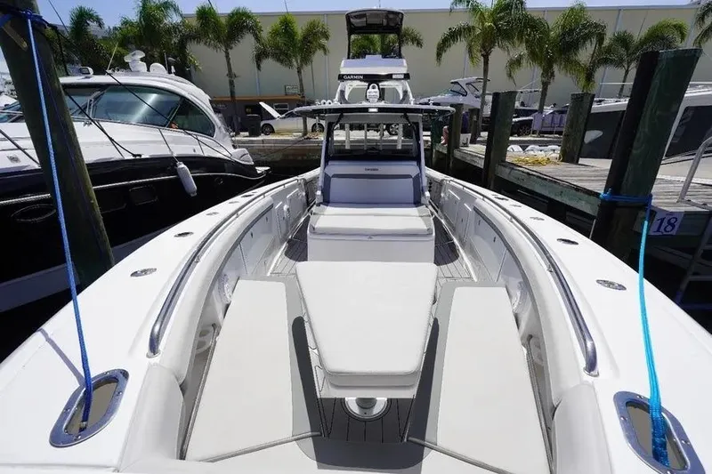  Yacht Photos Pics 2016 Everglades 435 Center Console boat docked, featuring spacious seating and modern design.