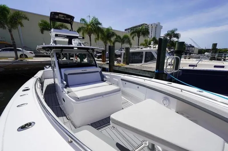  Yacht Photos Pics 2016 Everglades 435 Center Console boat docked, featuring spacious seating and modern design.