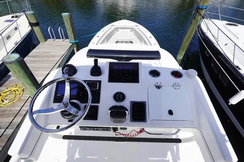  Yacht Photos Pics 2016 Everglades 435 Center Console boat helm with steering wheel and controls.
