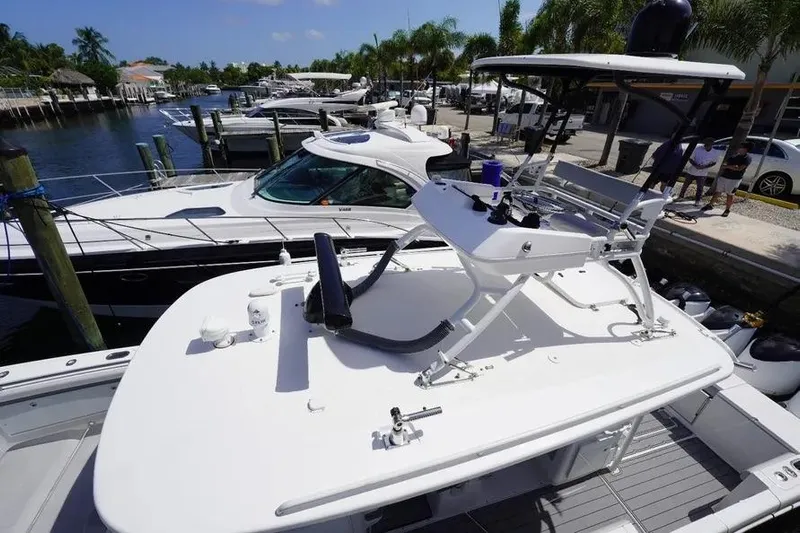  Yacht Photos Pics 2016 Everglades 435 Center Console boat docked at marina with palm trees.