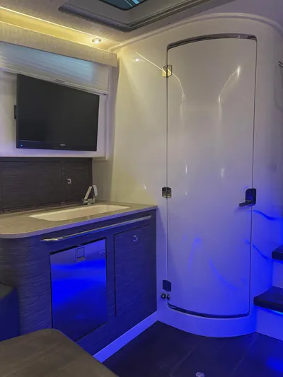 Demo Diamond Yacht Photos Pics Interior of 2017 Boston Whaler 420 Outrage with modern kitchenette and ambient lighting.