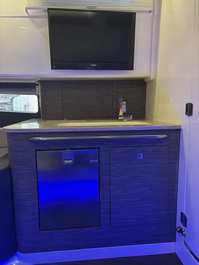 Demo Diamond Yacht Photos Pics Interior of 2017 Boston Whaler 420 Outrage with kitchenette and TV.