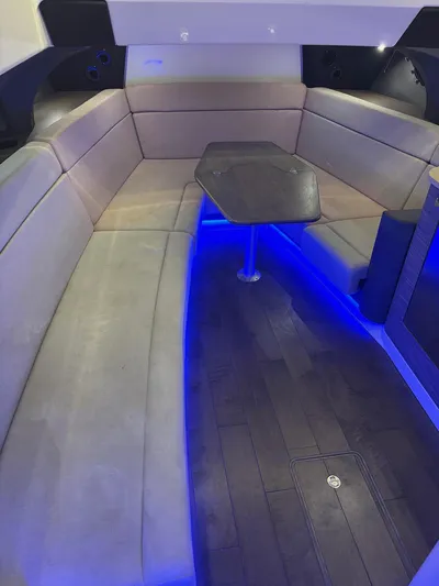 Demo Diamond Yacht Photos Pics Interior of 2017 Boston Whaler 420 Outrage with blue LED lighting and cushioned seating.