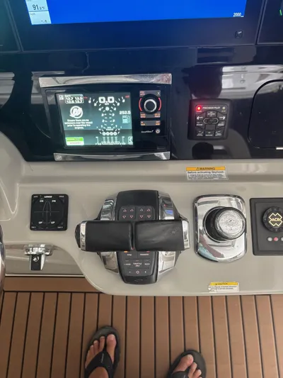 Demo Diamond Yacht Photos Pics Control panel of a 2017 Boston Whaler 420 Outrage boat with navigation displays.