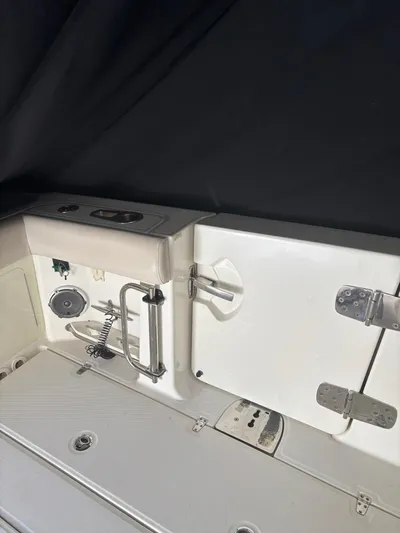 Demo Diamond Yacht Photos Pics 2017 Boston Whaler 420 Outrage boat interior with stainless steel fixtures and storage compartments.