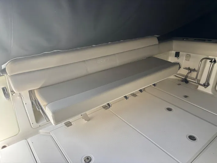 Demo Diamond Yacht Photos Pics 2017 Boston Whaler 420 Outrage boat interior with cushioned seating and storage compartments.