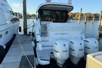  Yacht Photos Pics 2021 Regal 38 XO boat docked with triple Yamaha engines.