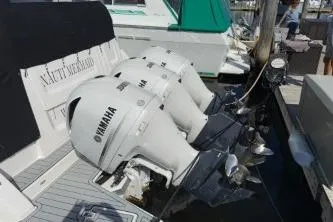  Yacht Photos Pics 2021 Regal 38 XO boat with triple Yamaha outboard engines docked.