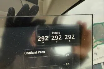  Yacht Photos Pics Dashboard display of a 2021 Regal 38 XO showing 292 hours and coolant pressure.