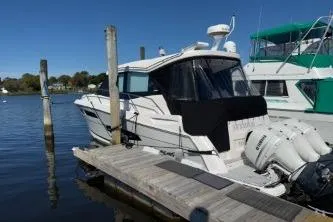  Yacht Photos Pics 2021 Regal 38 XO boat docked at marina with clear blue sky.