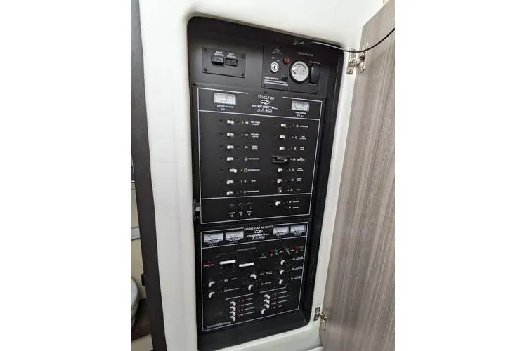 Yacht Photos Pics Electrical control panel on a 2021 Regal 38 XO boat, featuring various switches and gauges.