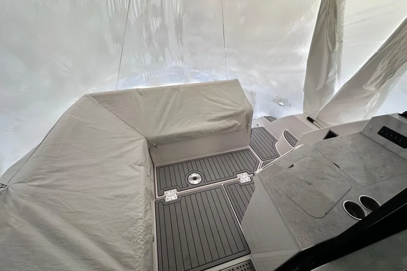  Yacht Photos Pics 2021 Regal 38 XO boat interior with covered seating and sleek flooring.