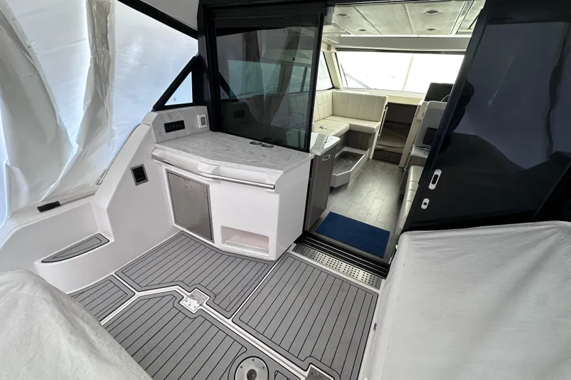  Yacht Photos Pics 2021 Regal 38 XO yacht interior with modern seating and sleek design.