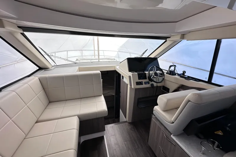  Yacht Photos Pics Interior of 2021 Regal 38 XO yacht with modern seating and helm.