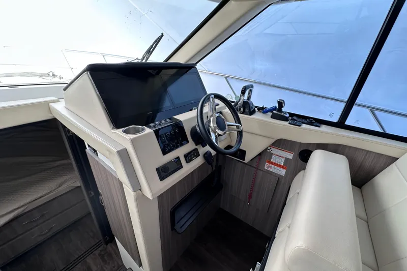  Yacht Photos Pics 2021 Regal 38 XO boat helm with modern controls and steering wheel.
