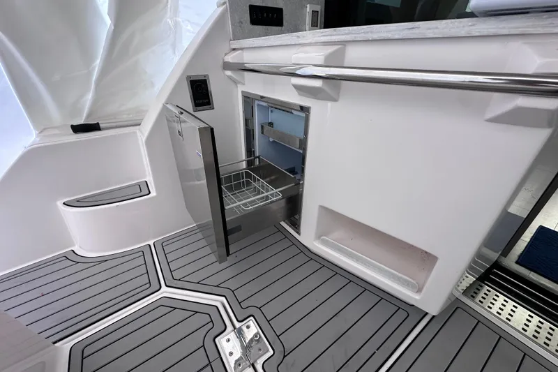 Yacht Photos Pics 2021 Regal 38 XO yacht interior with open drawer and sleek flooring.
